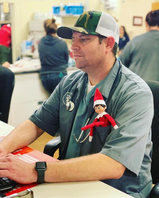 Dr. Fish working hard with our Elf, Ralphie, assisting him